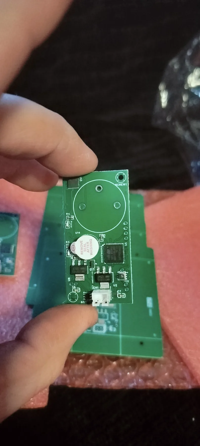 The fabricated AeroHive Sentinel prototype board in hand.